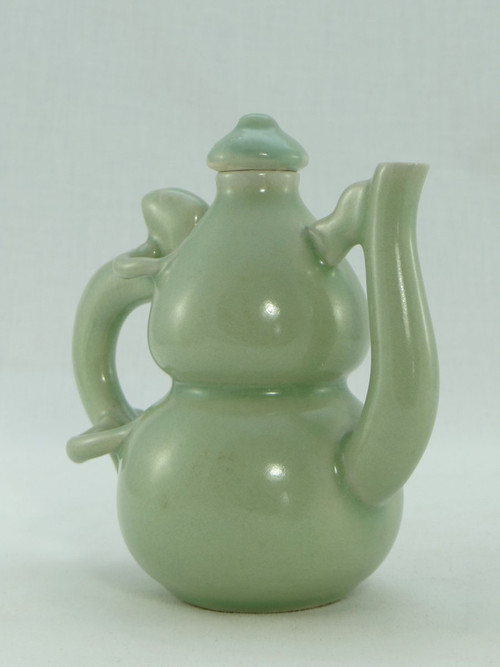 China, Mid-20th Century, Celadon porcelain teapot, two-lobed form.