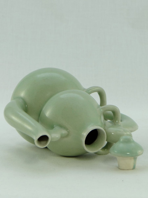 China, Mid-20th Century, Celadon porcelain teapot, two-lobed form.