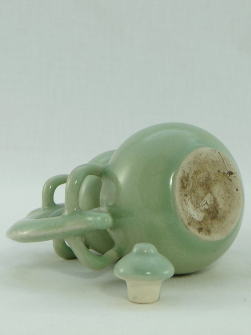 China, Mid-20th Century, Celadon porcelain teapot, two-lobed form.