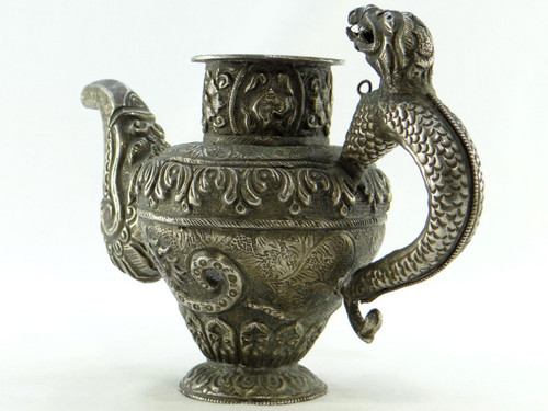 Tibet, Early 20th Century, Repoussé Silver Teapot.