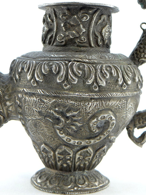 Tibet, Early 20th Century, Repoussé Silver Teapot.