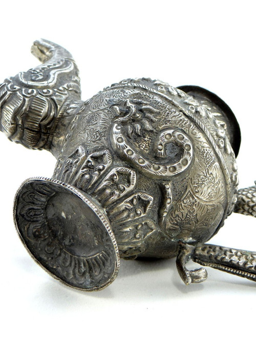 Tibet, Early 20th Century, Repoussé Silver Teapot.