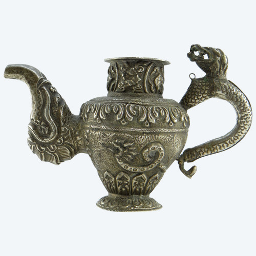 Tibet, Early 20th Century, Repoussé Silver Teapot.