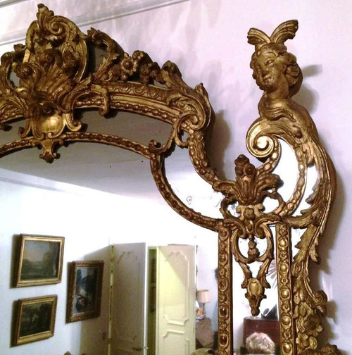 Eccezionale specchio in legno intagliato e dorato d'epoca Regence