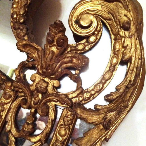 Eccezionale specchio in legno intagliato e dorato d'epoca Regence