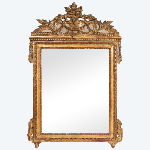 Louis XVI period carved giltwood mirror