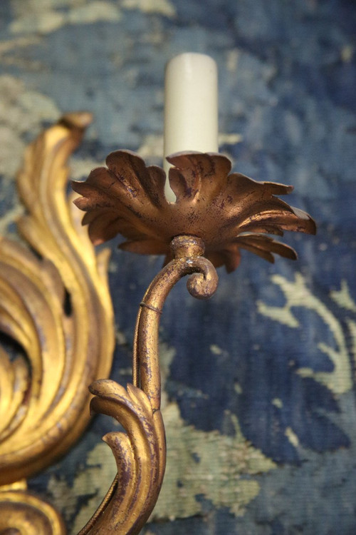 Suite of three gilded sheet metal sconces in the rocaille style.