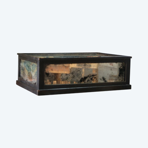 Large blackened wood base and mercury mirror.