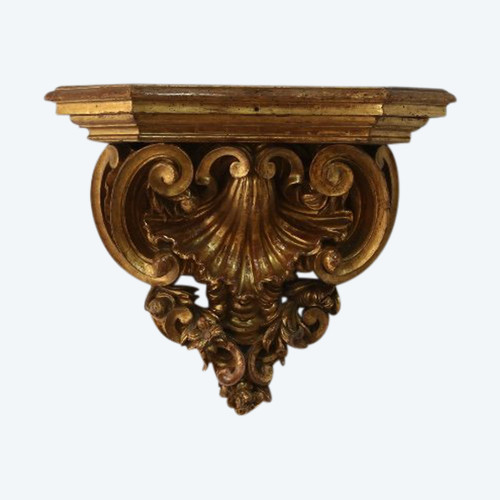 Large wall console in gilded wood, Italian work in the Baroque style.