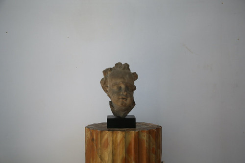 Grey stoneware sculpture of a child's face, Netherlands, early 18th century.