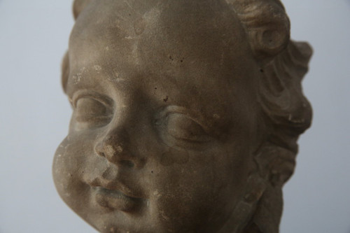 Grey stoneware sculpture of a child's face, Netherlands, early 18th century.