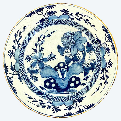 Delft, XVIIIth Century, Earthenware Dish Decorated With A Flowery Rock.