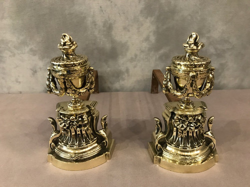 Pair Of Antique Louis XVI Style Polished Bronze Andirons From The 19th Century