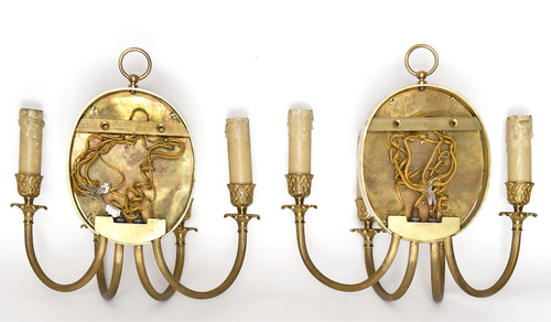 Pair of brass and gilded metal wall lights decorated with a Bacchus mask