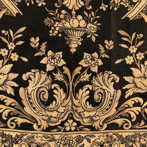 Antique tapestry or table cloth on a black background with rich decorations of Medici vases and flowers