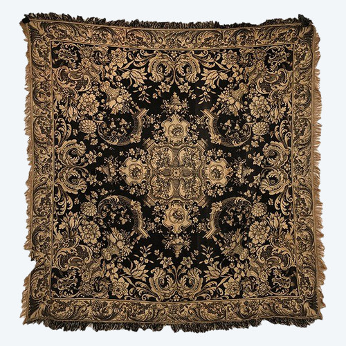 Antique tapestry or table cloth on a black background with rich decorations of Medici vases and flowers