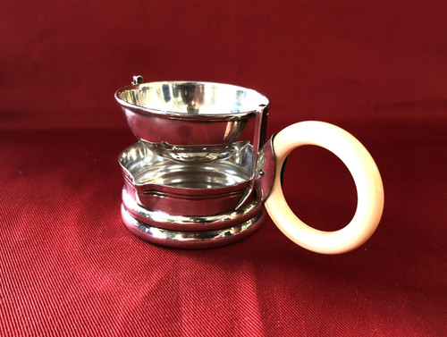 Rocking tea strainer in hallmarked solid silver, ivory handle, late 19th century.