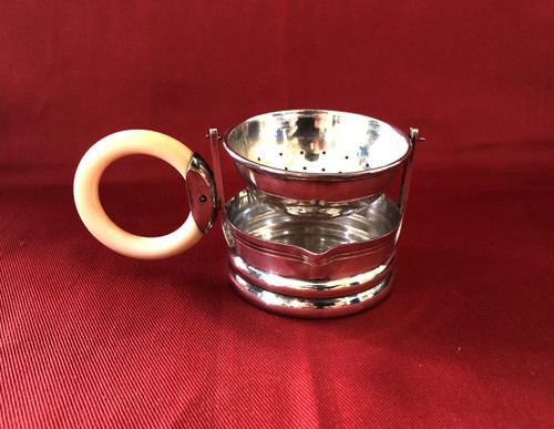 Rocking tea strainer in hallmarked solid silver, ivory handle, late 19th century.