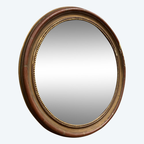  Gilded wood mirror with "witch's eye" patina, circa 1900