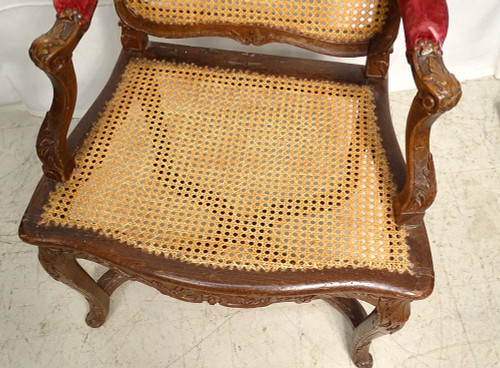 Poltrona Regency in canna di faggio intagliata con conchiglie fogliate XVIII secolo