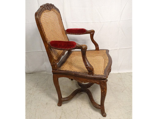 Poltrona Regency in canna di faggio intagliata con conchiglie fogliate XVIII secolo