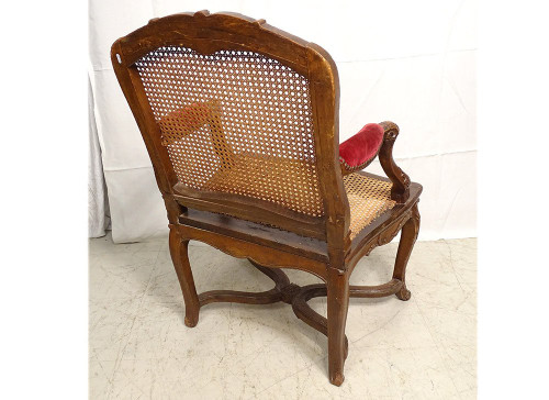 Poltrona Regency in canna di faggio intagliata con conchiglie fogliate XVIII secolo