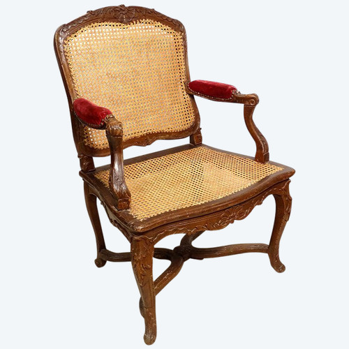 Poltrona Regency in canna di faggio intagliata con conchiglie fogliate XVIII secolo