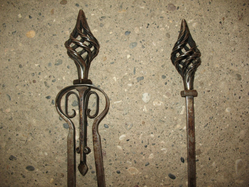 Pair of wrought-iron andirons complete with shovel, tongs and bar, 20th century