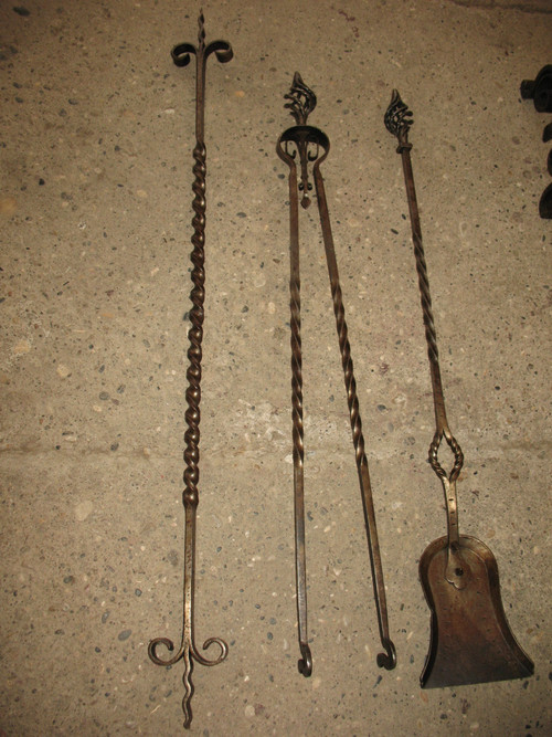 Pair of wrought-iron andirons complete with shovel, tongs and bar, 20th century