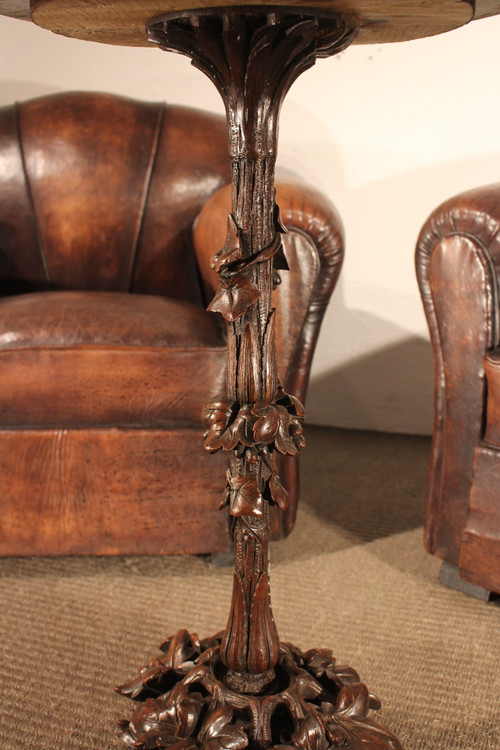 Black Forest type pedestal table Beautiful 19th century travel clock circa 1820, called a nasturtium, also serving as an alarm clock, wire movement with advance or delay adjustment, nickel-plated bronze bell with double hammer, revised movement, very good condition.