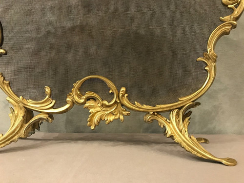 Old fireplace screen in gilded bonze from the 19th century, Louis XV style