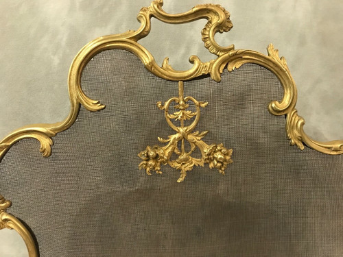 Old fireplace screen in gilded bonze from the 19th century, Louis XV style