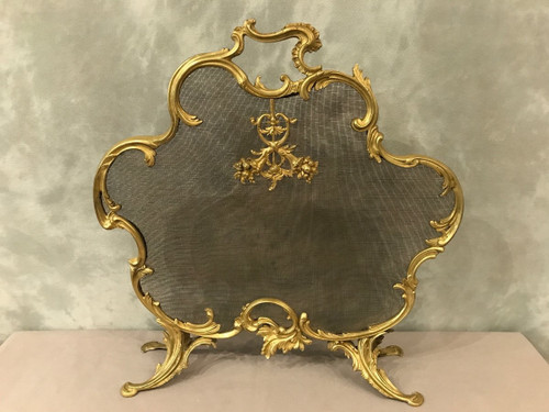 Old fireplace screen in gilded bonze from the 19th century, Louis XV style