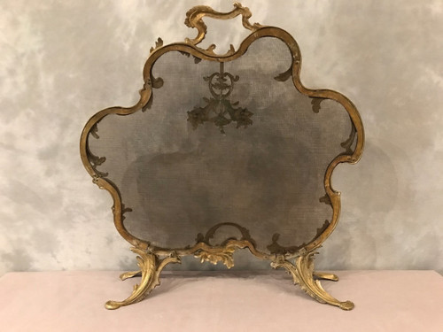 Old fireplace screen in gilded bonze from the 19th century, Louis XV style
