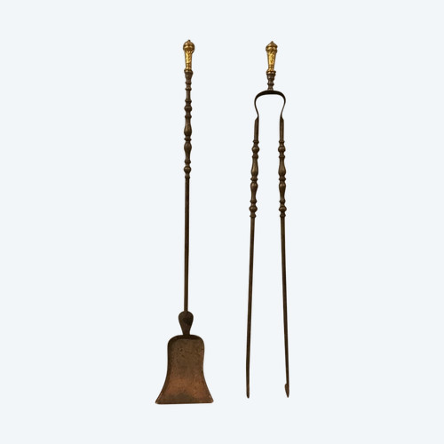 Set of a shovel and tongs in iron and gilded bronze from the 19th century in Louis XVI style