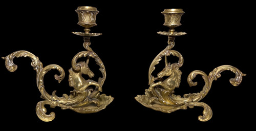 Pair of 19th century bronze candlesticks. Sea unicorns.