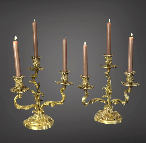 PAIR OF NUMBERED THREE-BRANCH GILT BRONZE CANDLE HOLDERS IN LOUIS XV STYLE