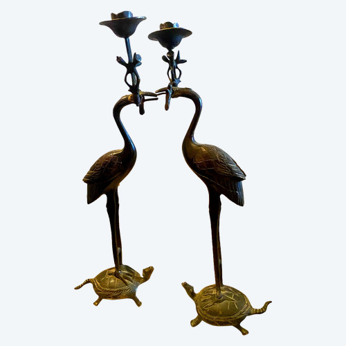 Pair of dark green patinated bronze candlesticks with articulated bobbins in the beak of a heron resting on a turtle 19th century Japanese