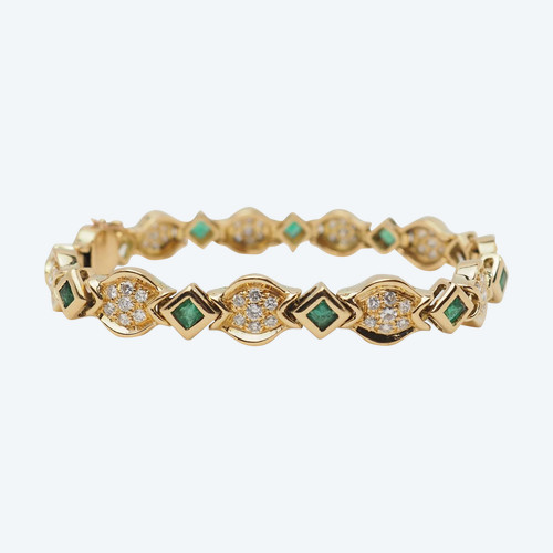 Bracelet in yellow gold, emeralds and diamonds