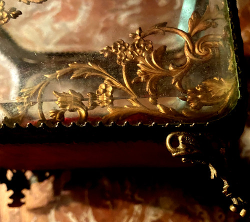 Large Napoleon III period beveled crystal jewelry box with chased bronze frame on all sides.
