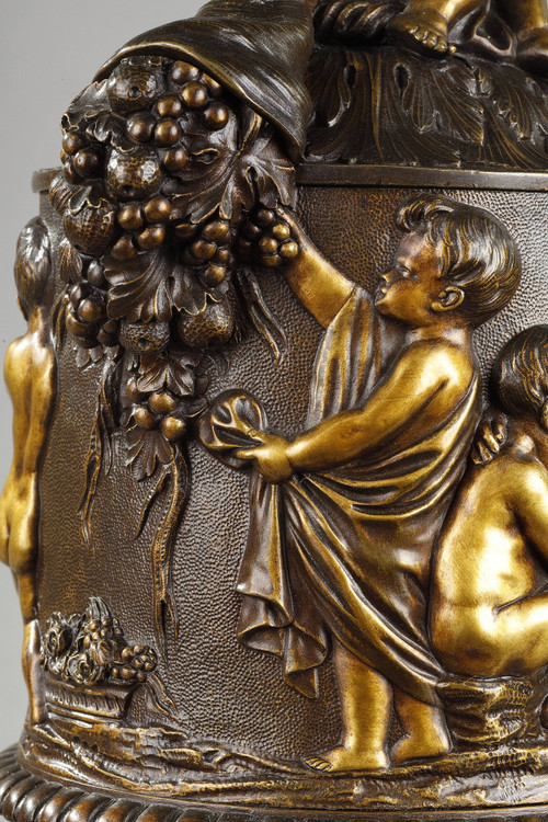 PAIR OF COVERED VASES, IN FINELY CHASED BRONZE WITH A RICH ROTATING DECORATION