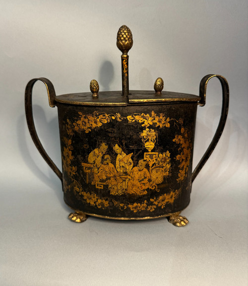 Egg maker in black and gold Chinese painted sheet metal, 19th century