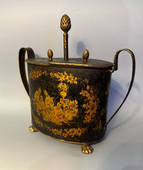 Egg maker in black and gold Chinese painted sheet metal, 19th century