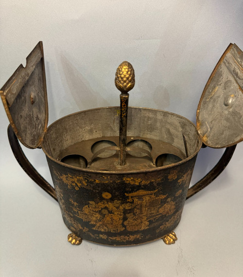 Egg maker in black and gold Chinese painted sheet metal, 19th century