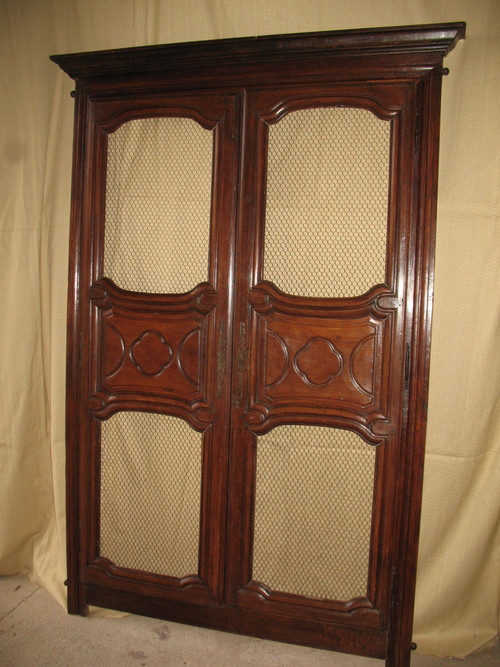 Facade of woodwork or library doors in walnut, late 18th century, Louis XIV style