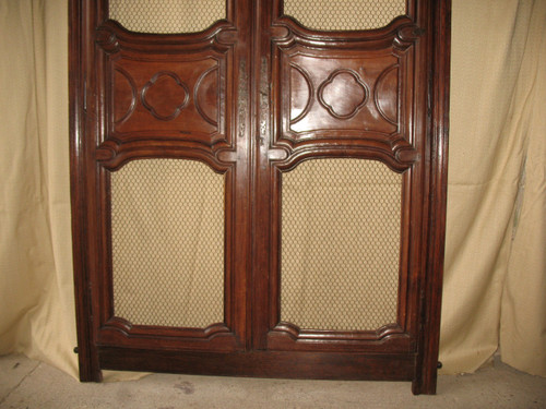 Facade of woodwork or library doors in walnut, late 18th century, Louis XIV style