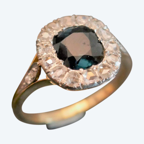 Ring verziert mit einem Saphir im Rosenschliff und Diamanten, Gold und Platin.