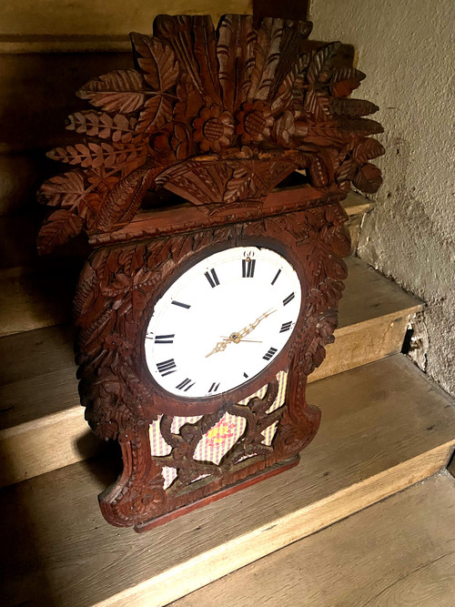 Richly carved in pine this lady's clock window from Upper Normandy, Cauchoise 18th