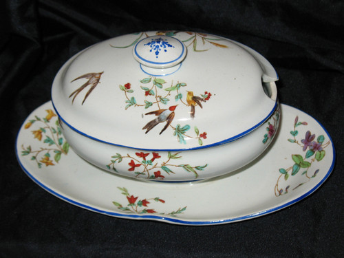 Table service in fine earthenware from Bordeaux, Nella decor with flowers and birds, 19th century