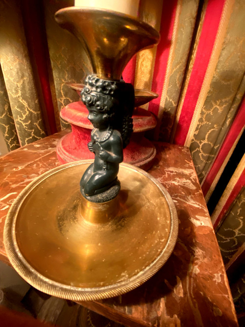Pair of charming Empire/Restoration style table candlesticks in gilded bronze and dark green patina